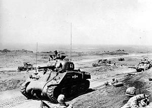 Click image for larger version. 

Name:	Marine_M4A2_Sherman_tanks_Advance_off_Beach_Iwo_Jima.jpg 
Views:	24 
Size:	36.9 KB 
ID:	271057